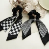 Early spring new black and white checkered large intestine circle bow ribbon hair accessory, thousand bird checkered large intestine hair circle elastic hair band accessory Specification image